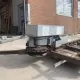 Gebruikte mest-transporteur met aandrijving in goede staat.